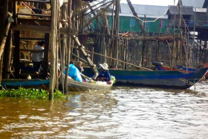 Vendor boats sell local fruits and other items